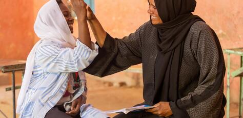 Walaa, 15, meets with Noha, a counselor at the UNICEF-supported Alshargia safe learning space in Kassala State, Sudan.